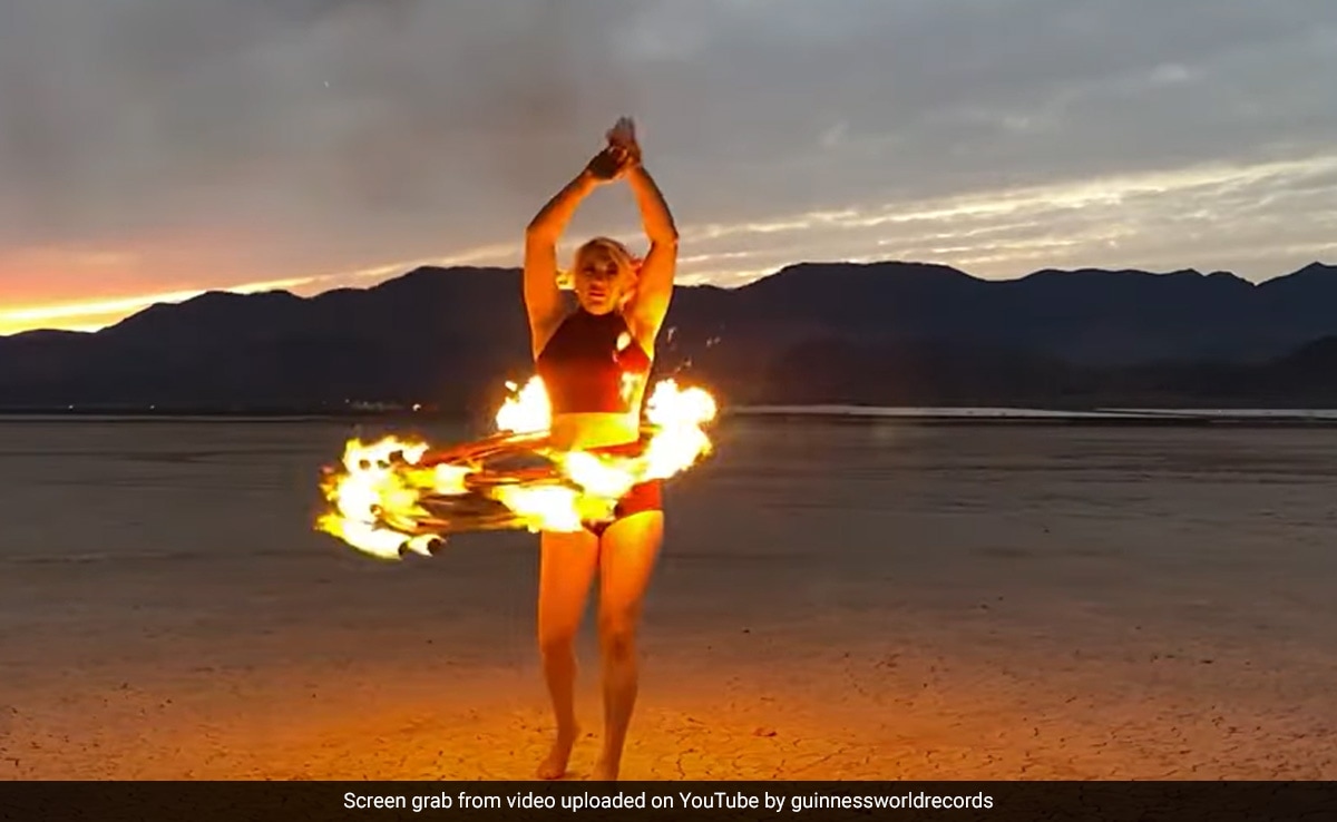 Circus Performer Spins 8 Flaming Hula Hoops, Breaks Guinness Record